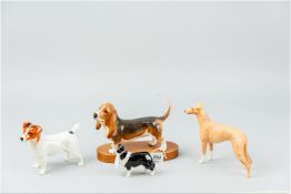 A Beswick Connoisseur model of a Bassett Hound on a wooden base, a Jack Russell Terrier, a black and