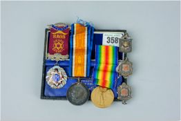 Two First World War medals and ribbons relating to M2-1, 02207, Private E Ringshaw ASC, a silver and