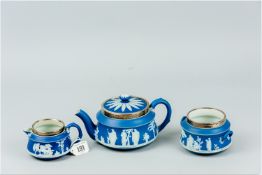 A three piece Wedgwood dark blue Jasperware bachelor tea service, each piece of circular form and