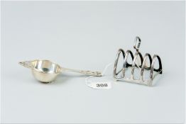A silver tea strainer, 1.4 ozs, Birmingham 1935 and a four section silver toast rack, 1.4 ozs,