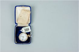 An eighteen carat gold encased lady's fob watch with a floral chased case, white enamel dial with