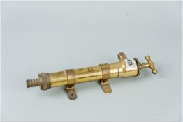 A one and a quarter inch brass whale pump by Munster Simms, Northern Ireland, approximately 12