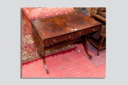 A Georgian mahogany sofa table, a crossbanded mahogany top and side leaves above two drawers with