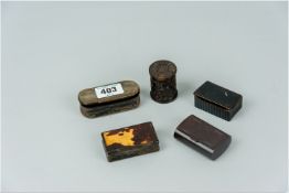 Four assorted bakelite, horn and papier mache snuff boxes and a small circular carved cylindrical