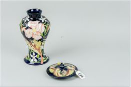 A Moorcroft 'Spring Dusk' lidded vase dated 2013, limited edition 30/35, 9.25 ins (23.5 cms) high