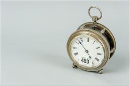 A well made single fusee maritime clock in a silvered metal case having faceted dial glass cover,