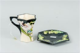 A Moorcroft 'Au Lait' coffee cup and saucer, circa 2010, the cup 4.5 ins (11.5 cms) high, the saucer