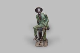 An early to mid 20th Century half lifesize bronze figure of an African/American gentleman dressed in