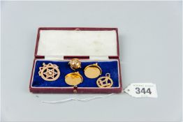 A fifteen carat gold Star of David pendant, 6 grms, a nine carat gold Masonic compass and square