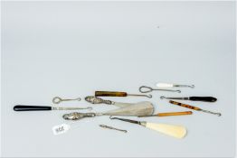 A small parcel of silver handled and other haberdashery hooks and shoe horns