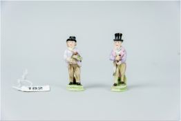 A pair of Rudolstadt Volkstedt miniature figures of two well dressed gentlemen, both having black