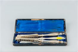 A four piece electroplated lobster picking set