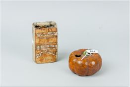 A Chinese pottery inkpot modelled in the form of a pumpkin having a mottled orangey brown exterior