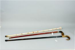 Two horn handled walking canes, one carved as a horse's hoof and a bone walking cane of segmented