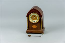 A nice quality mahogany dome topped mantel clock with pendulum, the mahogany case line inlaid with a