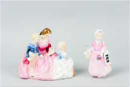 A Royal Doulton group 'Bedtime Story' HN2059 along with a Royal Doulton china figurine '