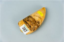 A scrimshaw tooth, one side having a scene depicting whalers, the reverse depicting a three masted