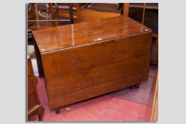 A period oak gate leg table, a simple planked form top and leaves with single end drawer on square