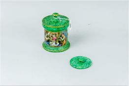 An excellent Prattware tobacco jar and cover with an overall green marbled effect pattern with