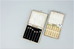 A cased set of six sterling silver cockerel cocktail sticks and a cased set of seven silver and
