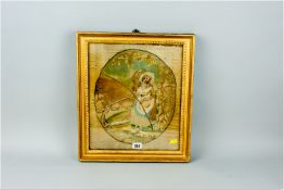 A gilt framed late 18th Century silkwork panel, oval bordered central panel of a young lady