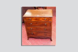 A small sized Regency mahogany four drawer chest having brass plate ring pull handles and