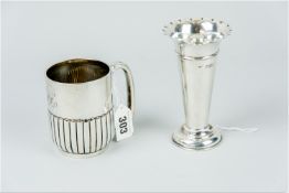 A silver mug, half plain/half reeded, 5 ozs, Sheffield 1891 and a silver trumpet vase with tapered