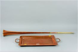 An oblong hand crafted twin handled copper tray, 17 x 9.5 ins (43 x 24 cms) and an antique copper