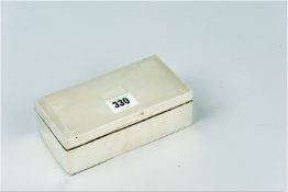 An oblong silver cigarette box, Birmingham 1966
