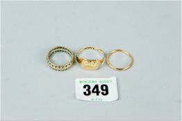A nine carat gold signet ring, a narrow nine carat gold wedding band and a gold and white metal