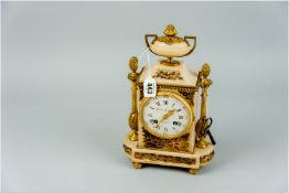 An attractive ormolu and pink marble encased mantel clock, the tall case on a stepped D-ended base