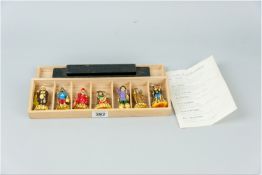 A collection of celluloid figures of the Gods of Good Fortune, seven colourful moulded figures along