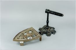 Cast iron goffering iron and a cast iron trivet stand marked 'Ibis 449'