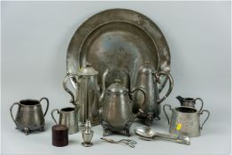 A large pewter charger, 17.5 ins (44.5 cms) diam, along with a quantity of further pewter and