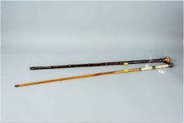 Two Victorian silver mounted walking sticks, Chester hallmark bowl topped cane containing a