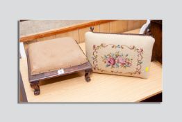 A square topped footstool on carved feet, the top requiring upholstery along with a tapestry