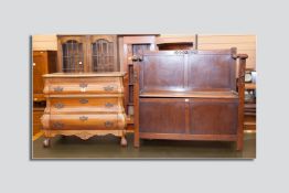 A reproduction Dutch oak Bombé style chest of three drawers and a 1930's oak monk's bench