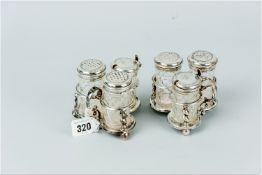 A pair of trefoil silver condiment sets, each set having three matching cylindrical diamond cut