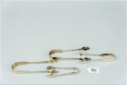 A parcel of four plain silver fiddle patterned sugar tongs, assorted dates, total weight 4 ozs