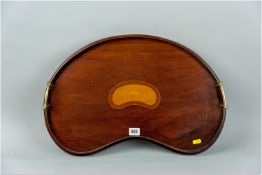 An Edwardian mahogany kidney shaped two handled tray with gallery edge, twin brass handles and