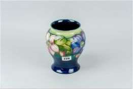 A Moorcroft waisted form vase, 6.5 x 6 ins (16.5 x 10.5 cms), (some glaze crackle and bubble