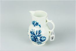 A Worcester blue and white decorated mask jug, moulded cabbage leaf decoration with pierced scroll
