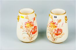 A pair of blush ground vases of tapering form, colour highlighted transfer decorated floral