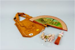 A leather casual bag 'Ottawa, Canada', a fan 'Montserrat', three small children’s dolls and a