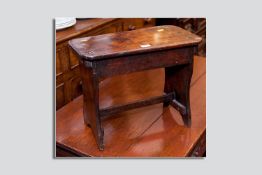 A good coloured early oak footstool, 13.75 x 17.25 ins (35 x 44 cms)