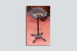 A cast iron tractor seat bar stool