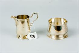 A plain silver cream jug and matching circular sugar basin, 2.9 ozs, London 1929