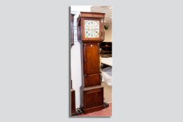 An oak eight day longcase clock, the square shaped hood with turned side columns and brass caps