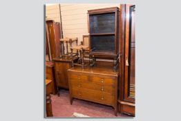 An oak mirrored four drawer chest, an open adjustable bookcase, two string topped oak stools and a