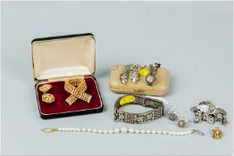 A parcel of mixed jewellery including a silver charm bracelet, 35 grms, two silver and marcasite